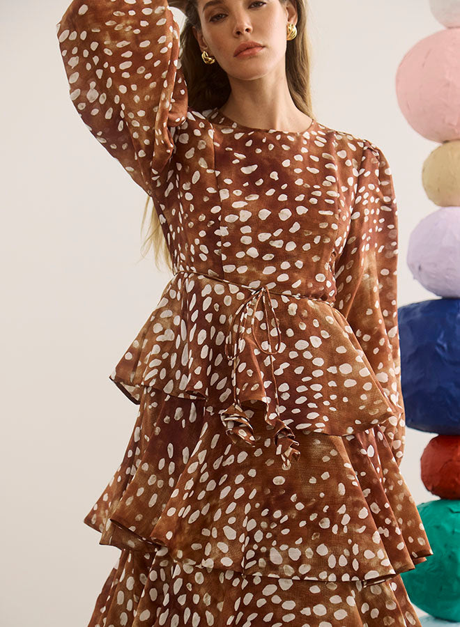 Model wearing Hunter Bell Chelsea Dress in brown Dappled Doe print with tiered ruffle skirt and tie waist