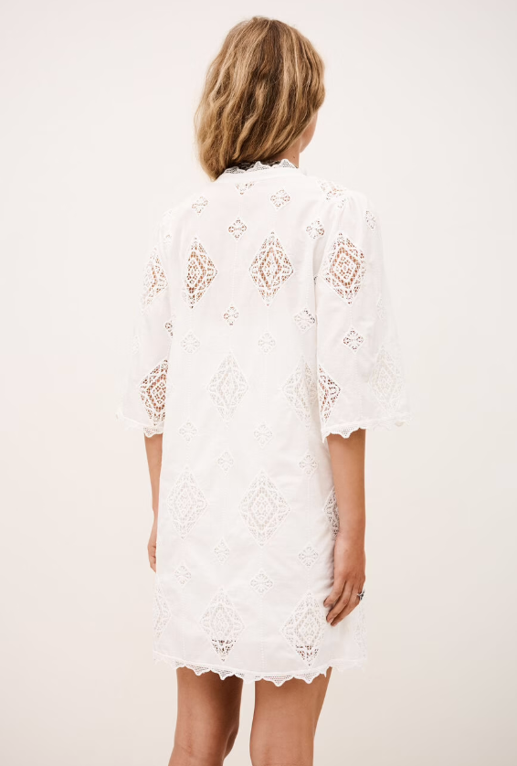 ba&sh Malo white lace dress with geometric eyelet pattern and scalloped hem, shown from back view