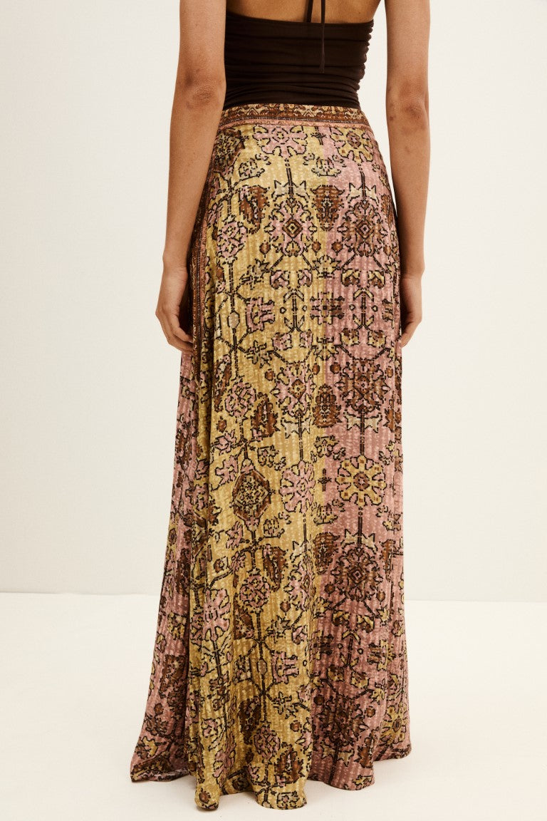 Model wearing ba&sh Pario maxi skirt in yellow paisley print with black top