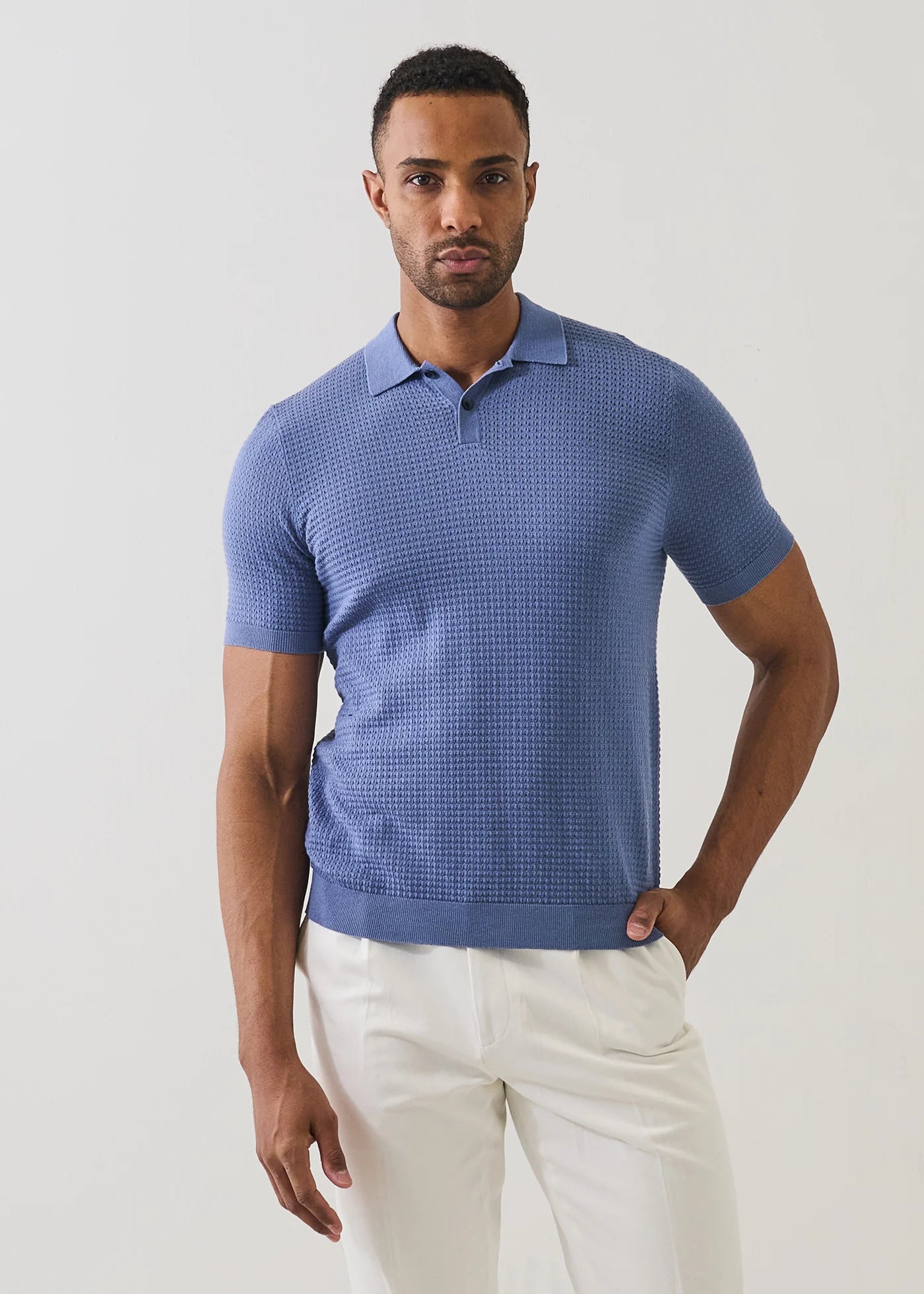 Patrick Assaraf short sleeve cotton cashmere performance stitch polo shirt in blue with textured knit pattern.