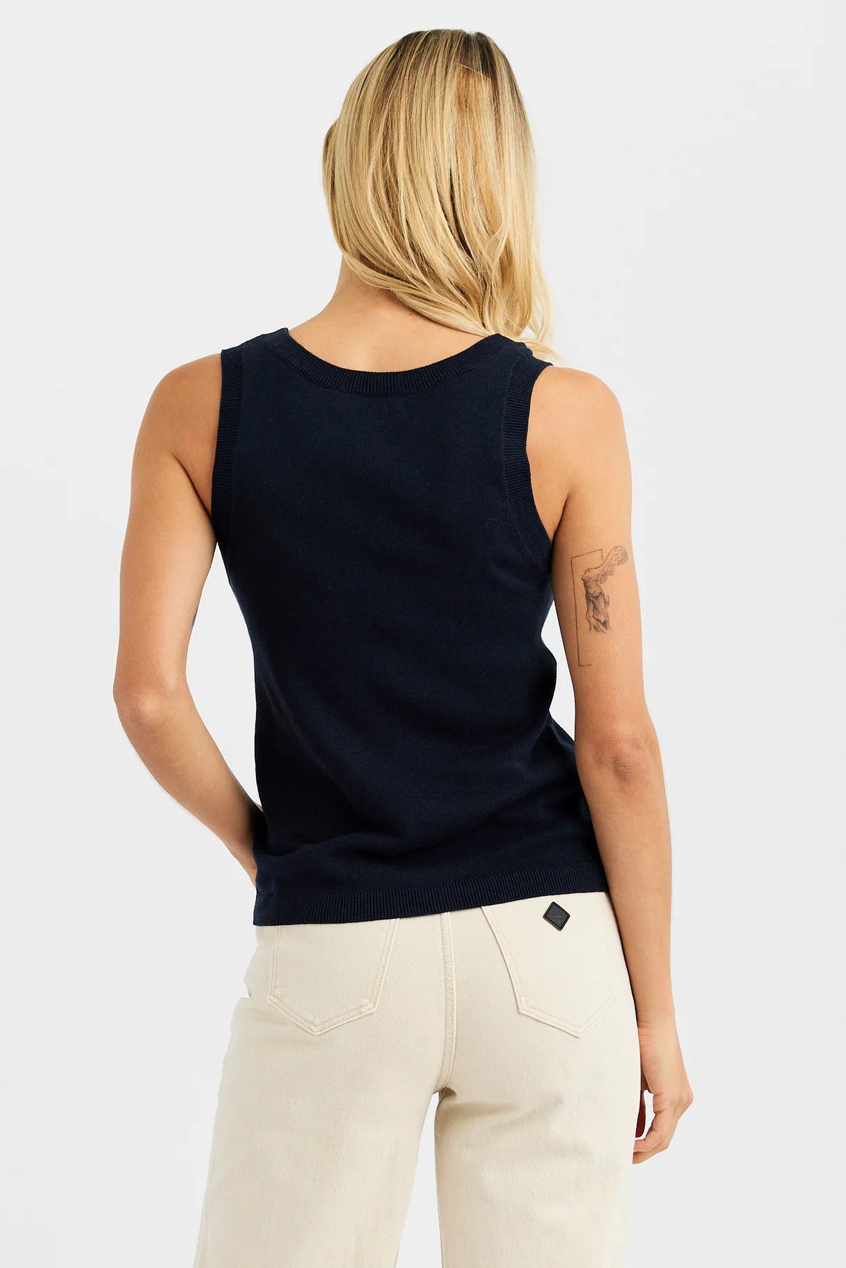 One Grey Day Terra Tank in navy blue, shown from back view with ribbed neckline and hem details