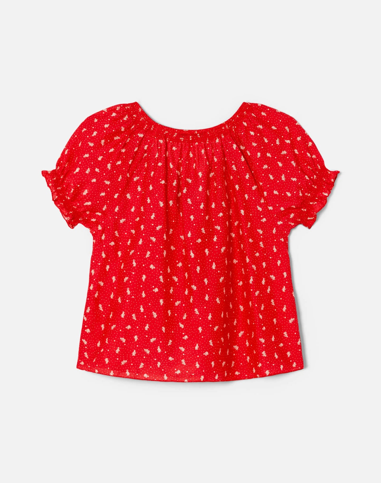 Re/Done Katie red embroidered top with white floral pattern and gathered short sleeves on light background.