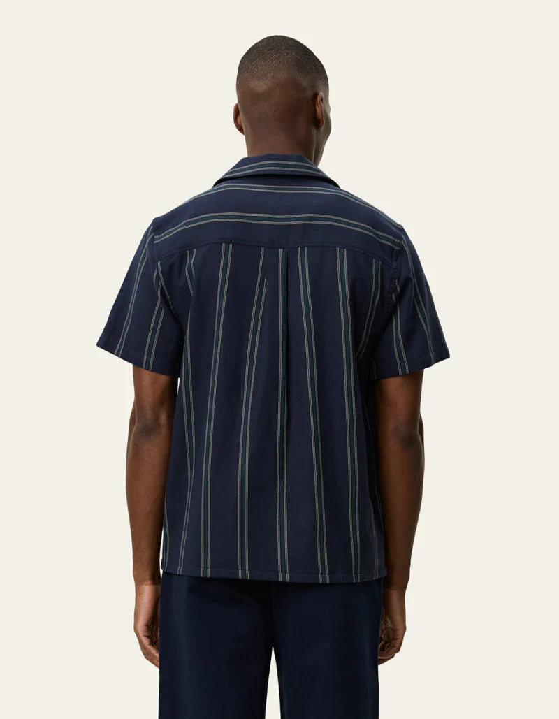 Les Deux Lawson short-sleeve striped shirt in dark navy, shown from behind on male model.
