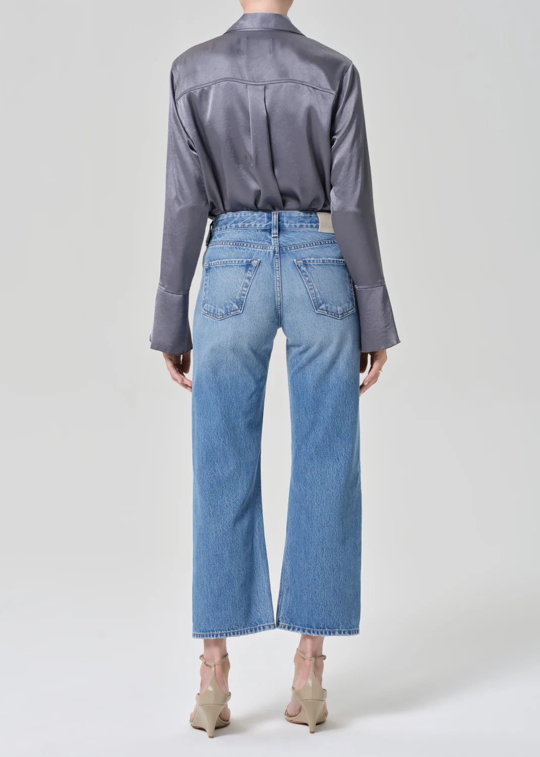 Citizens of Humanity Faye Vintage Straight jeans in Lolita wash shown from behind with grey silk shirt