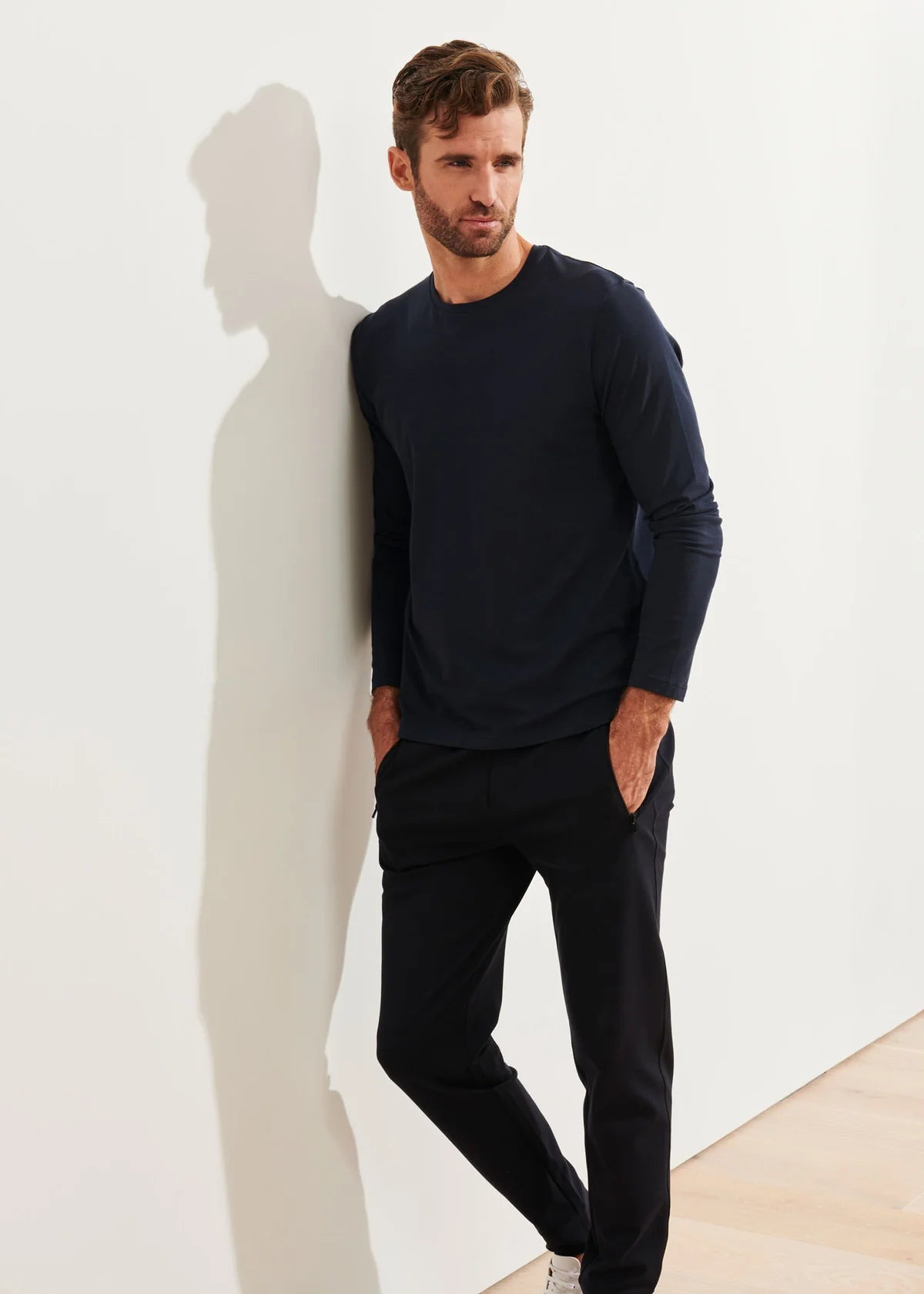 Patrick Assaraf men's long sleeve navy crew neck tee, worn with black trousers, relaxed fit.