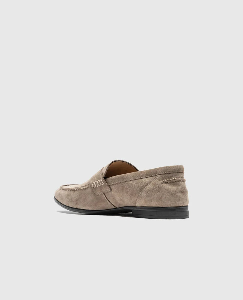 Rodd & Gunn St James sand suede loafer with stitched detailing and black sole, shown from side angle.