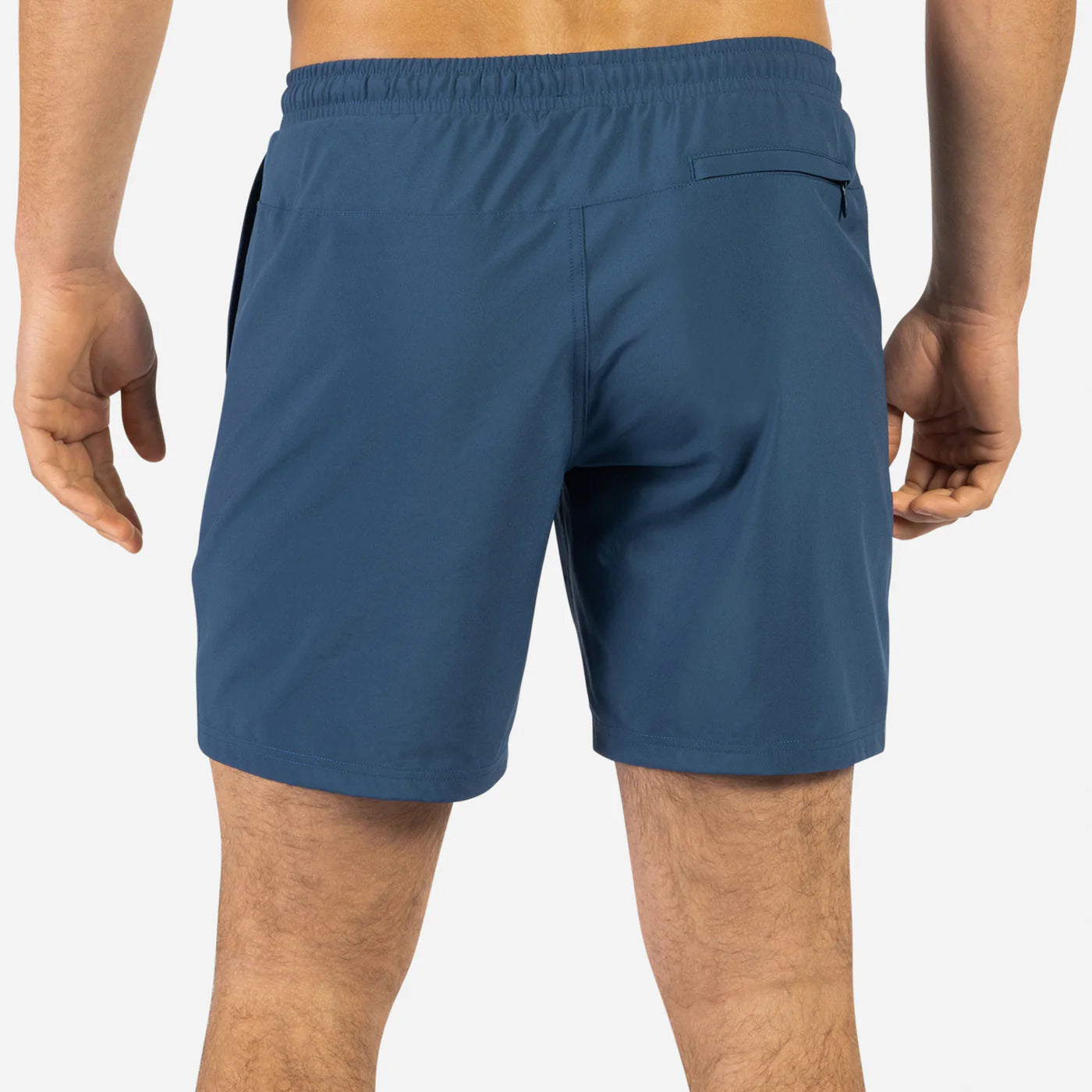 Rear view of man wearing BN3TH navy blue volley shorts with elastic waistband and back pocket.