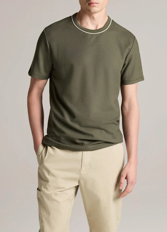 Man wearing olive green short sleeve crew neck t-shirt with tipped neckline detail