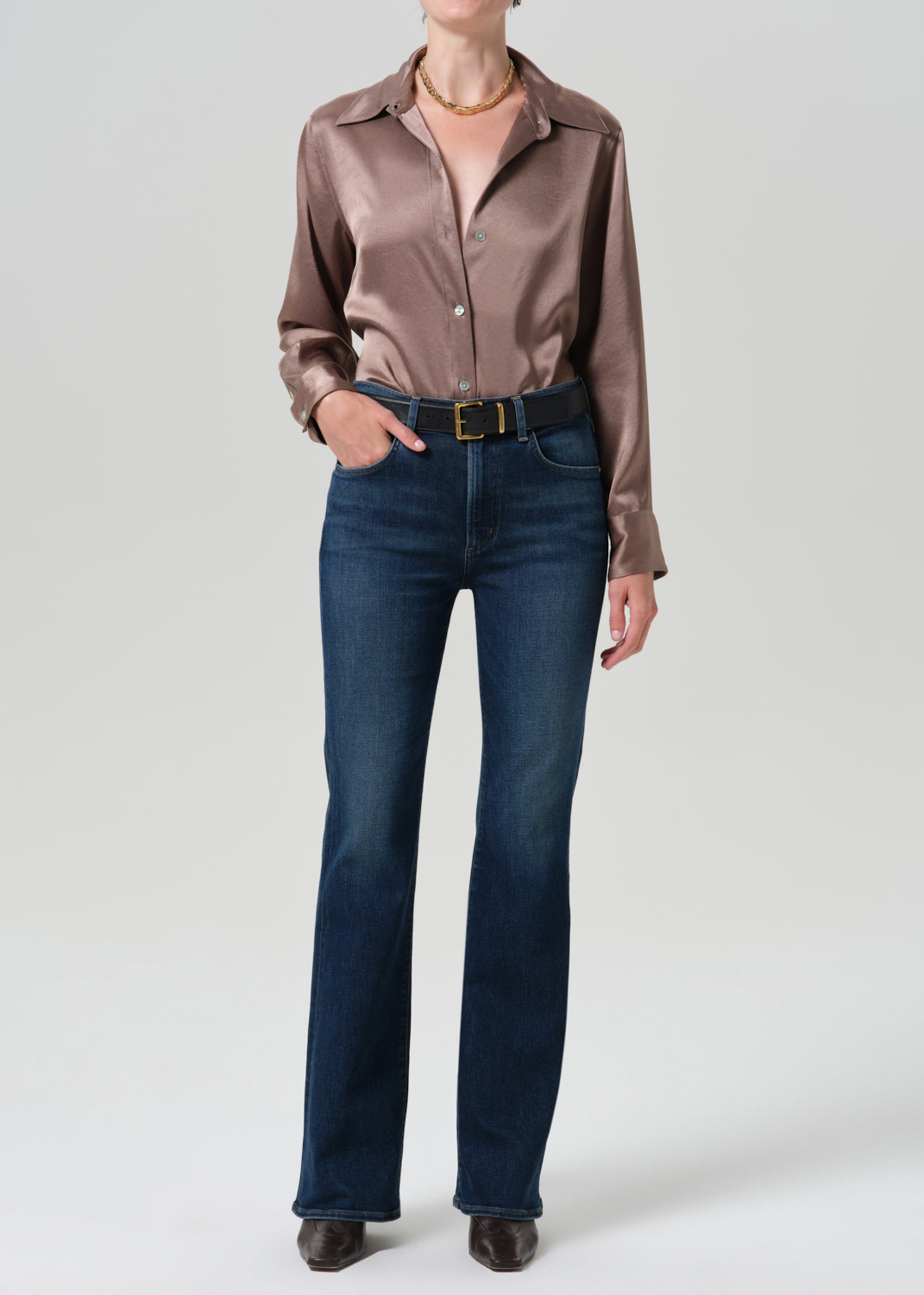 Model wearing Citizens of Humanity Lilah high rise bootcut jeans in dark indigo Moonlight wash