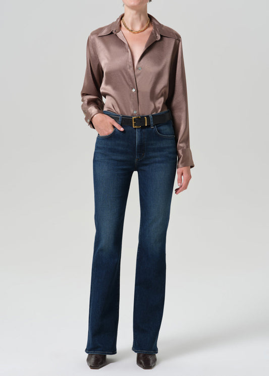 Model wearing Citizens of Humanity Lilah high rise bootcut jeans in dark indigo Moonlight wash