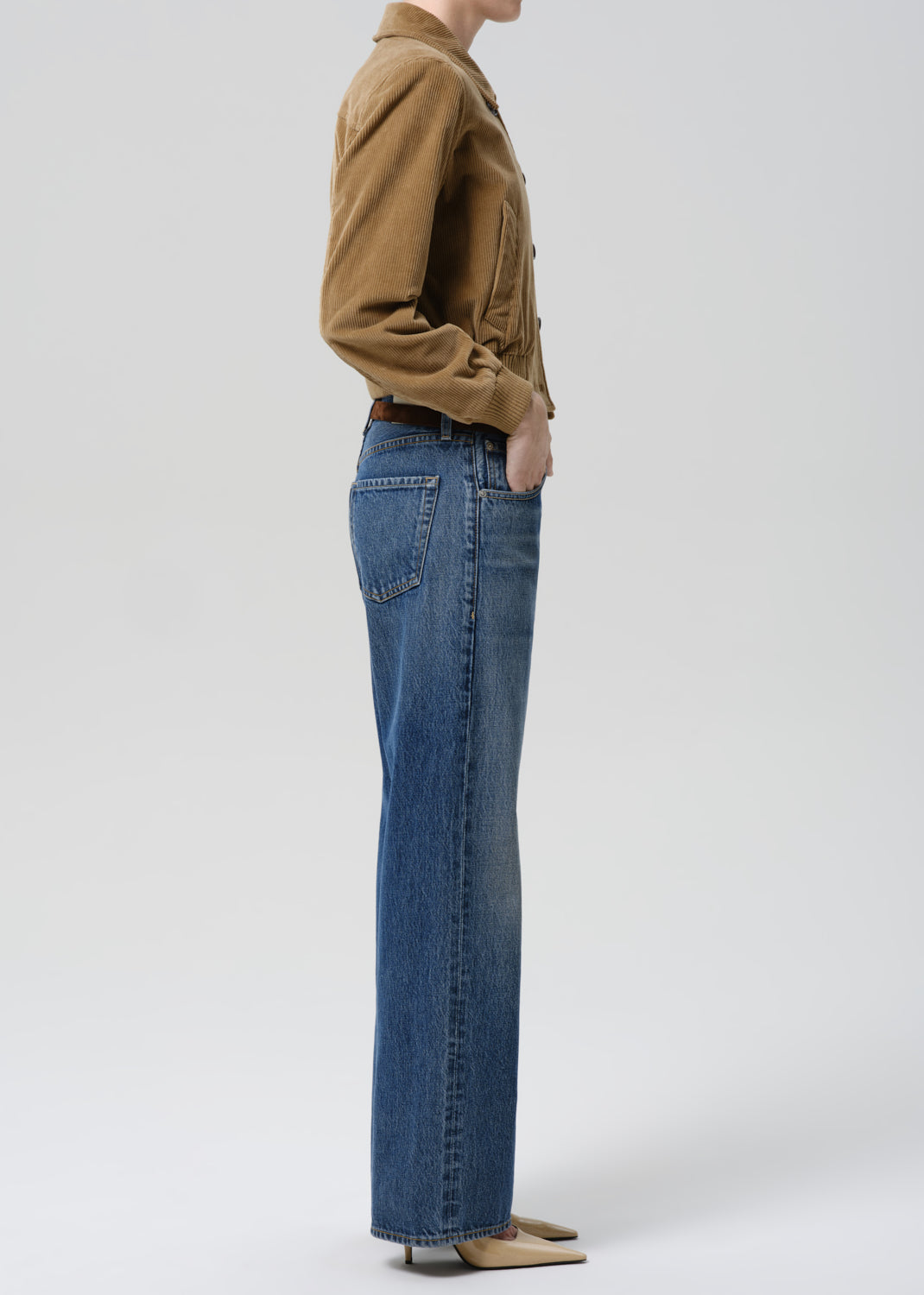 Side view of model wearing Citizens of Humanity Lindz Easy Straight jeans in Twilight mid-blue wash