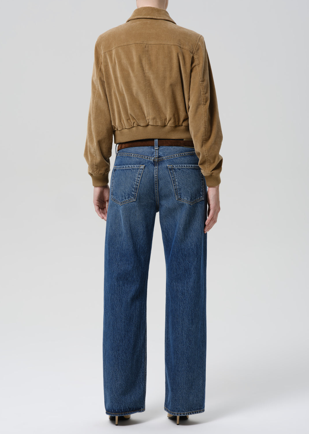 Back view of model wearing Citizens of Humanity Lindz Easy Straight jeans in Twilight medium blue wash with wide straight ...
