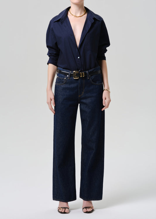 Model wearing Citizens of Humanity Lindz Easy Straight jeans in dark indigo Amherst wash with navy shirt
