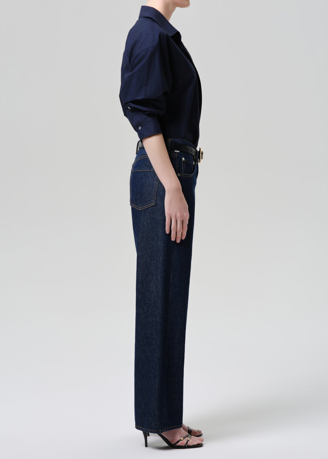 Side view of model wearing Citizens of Humanity Lindz Easy Straight jeans in dark indigo Amherst wash