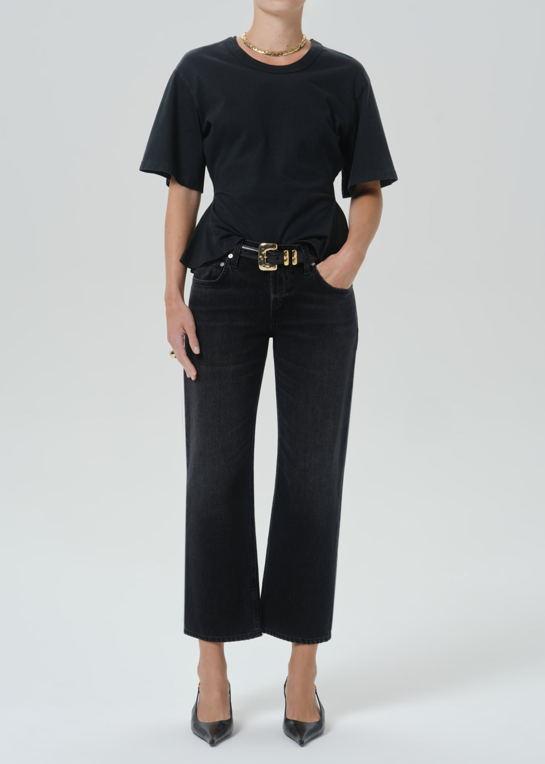 Model wearing Citizens of Humanity Faye Vintage Straight jeans in dark washed black Raine colorway