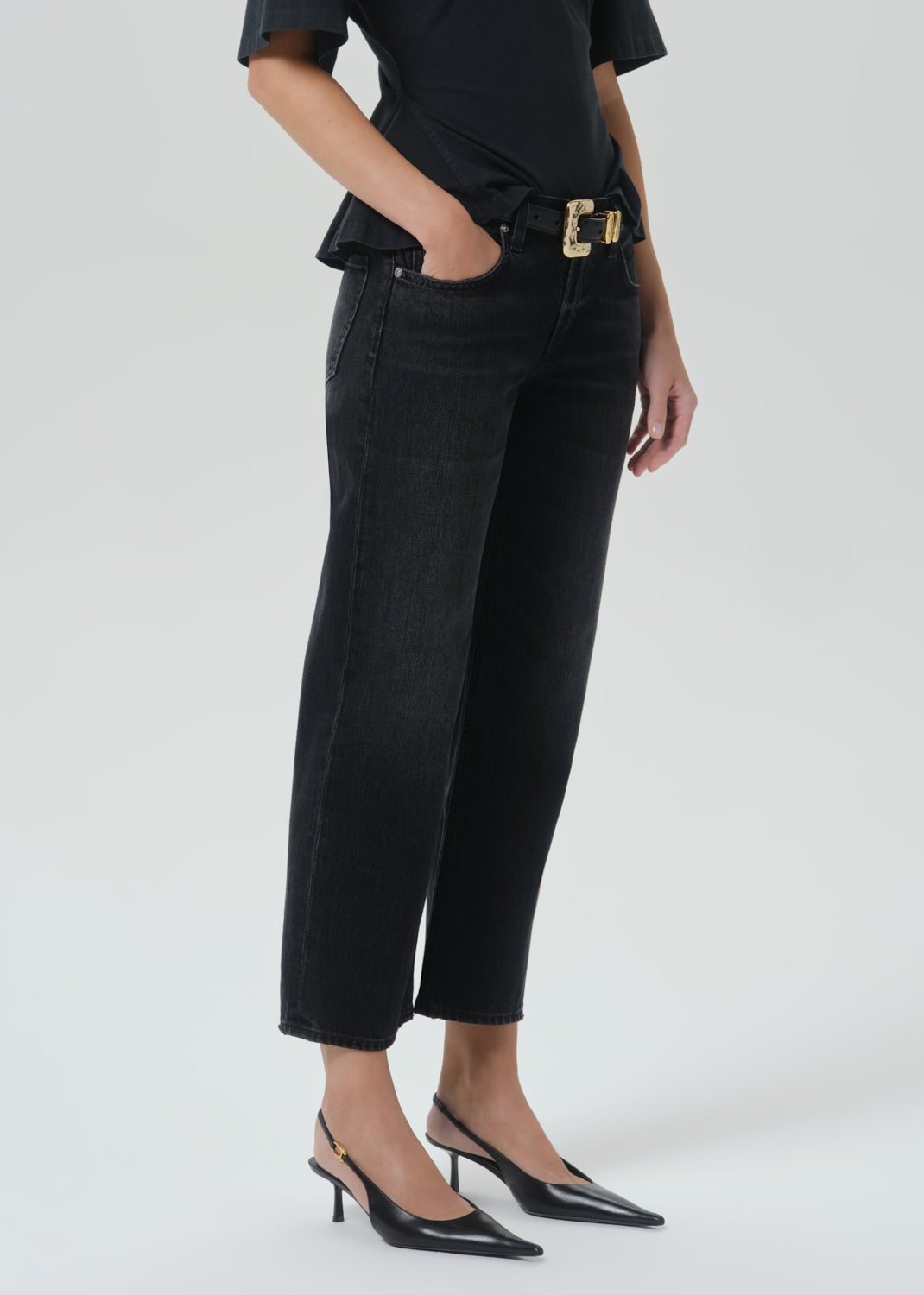 Model wearing Citizens of Humanity Faye Vintage Straight jeans in dark washed black Raine colorway