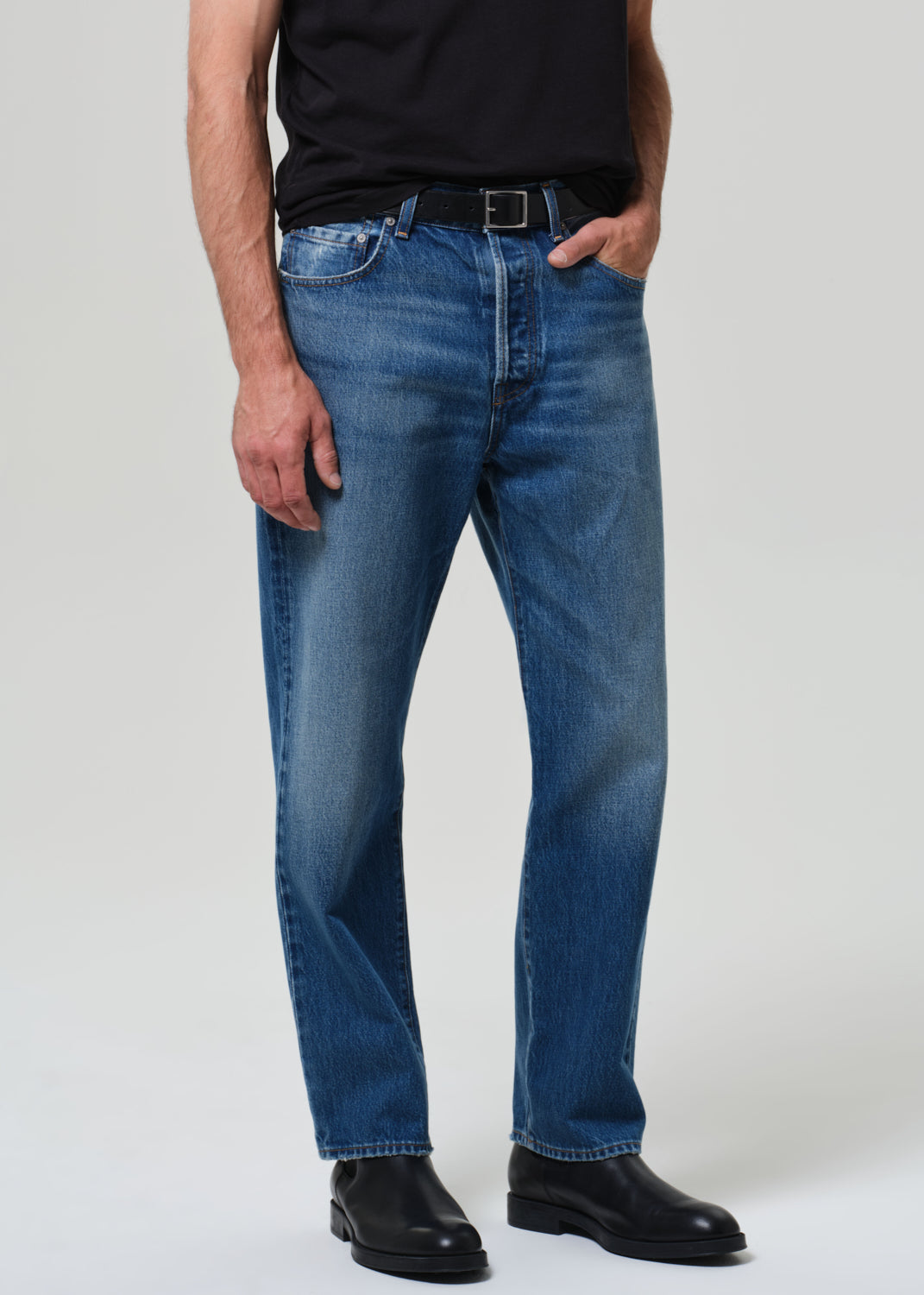 Model wearing Citizens of Humanity Beau straight leg jeans in mid blue wash