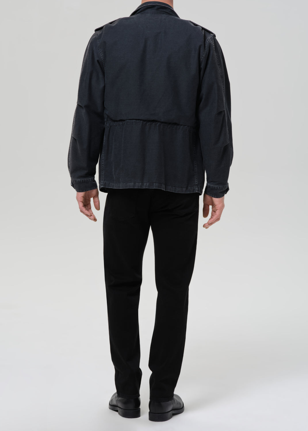 Back view of male model wearing Citizens of Humanity Elijah Straight jeans in black Starless wash