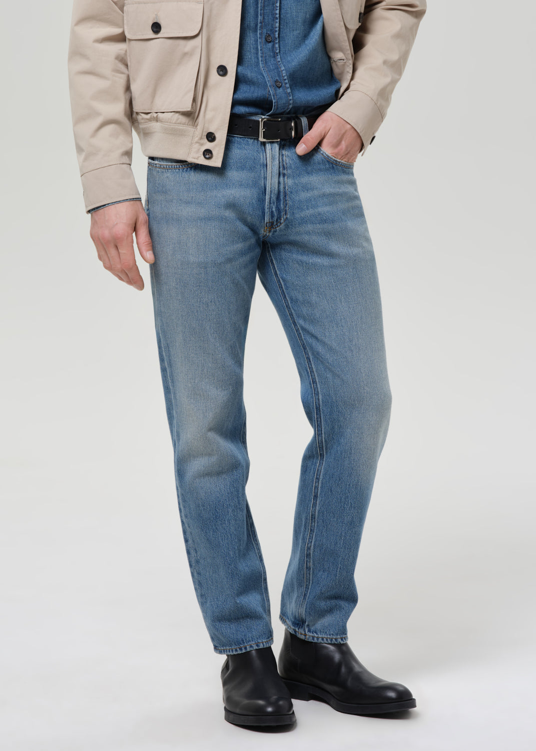 Man wearing Citizens of Humanity Elijah straight jeans in Shadow Blue medium wash
