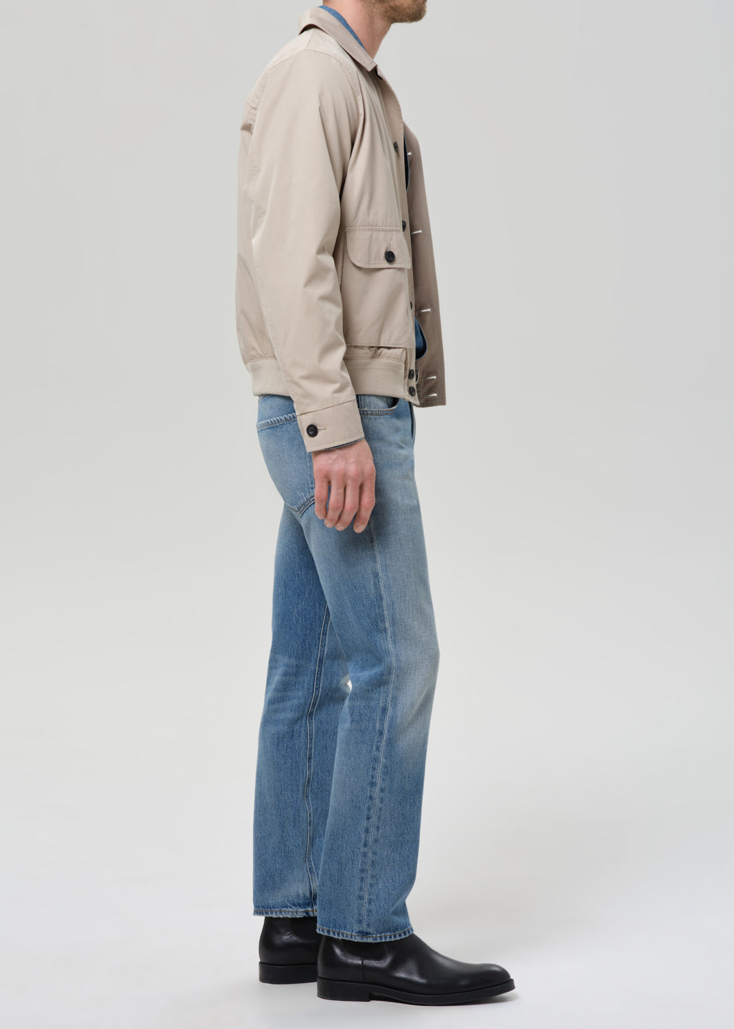 Male model wearing Citizens of Humanity Elijah straight jeans in Shadow Blue medium wash