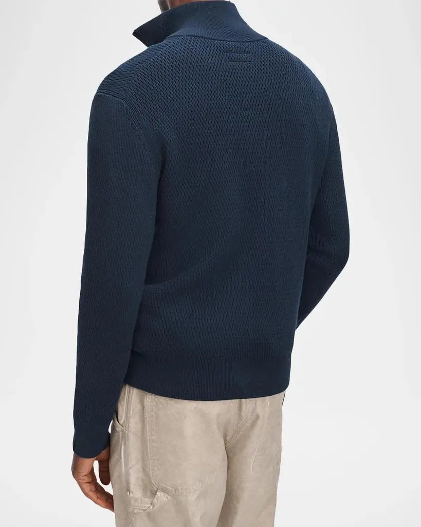 Back view of navy waffle-knit quarter-zip sweater with textured pattern on male model