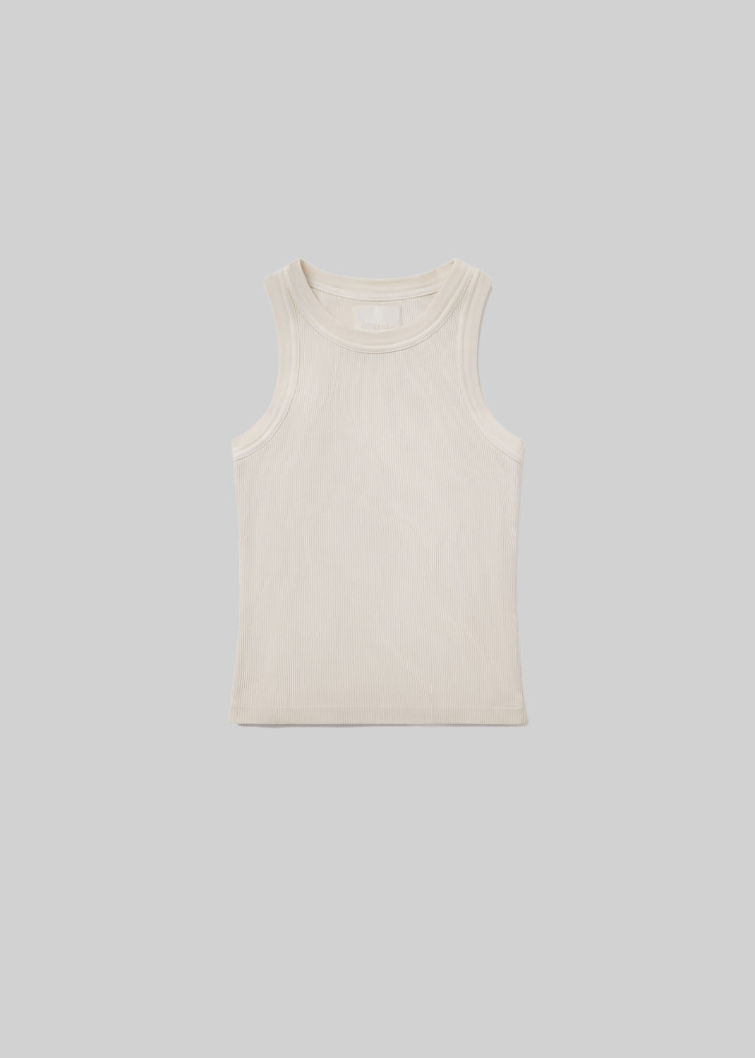 cream colored ribbed sleeveless tank top on neutral background