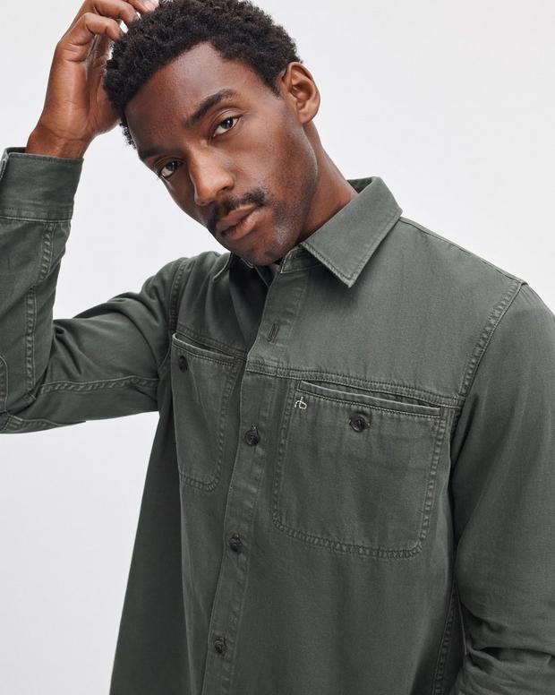 Male model wearing Rag & Bone dark green denim workwear shirt with chest pocket