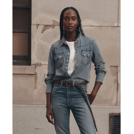 Model wearing The GREAT Howdy Top in Oldham Wash denim with pearl snap buttons
