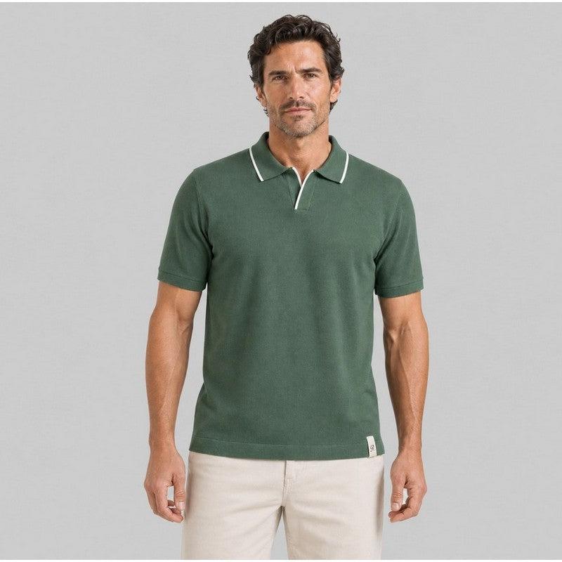 Man wearing olive green short-sleeve polo shirt with white tipped collar and khaki pants