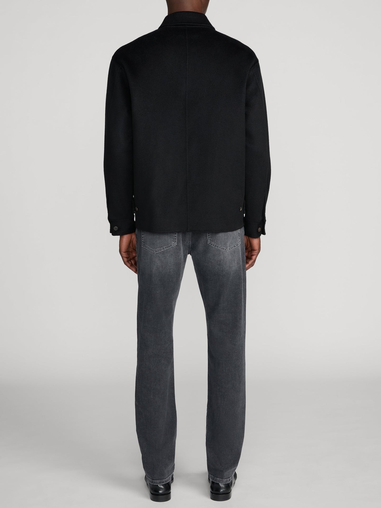 Back view of Frame L'Homme Slim jeans in Midnight Ash grey wash on male model