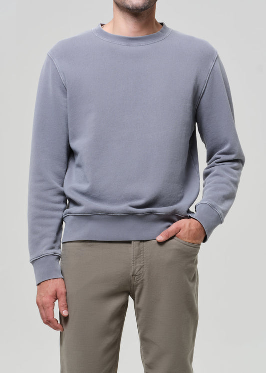 Male model wearing Citizens of Humanity Vintage Crewneck Sweatshirt in Heron Grey with khaki pants