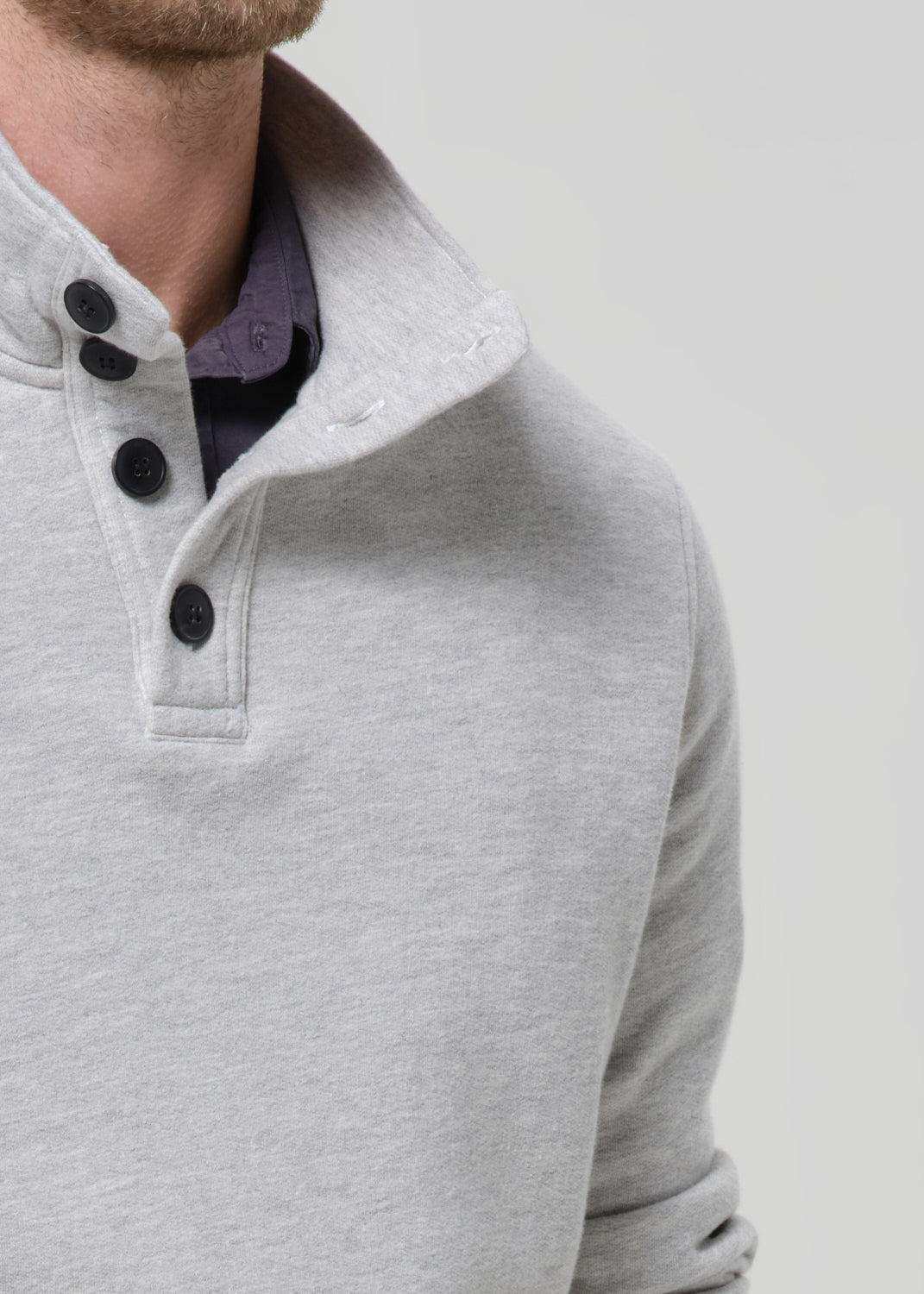Close-up of Citizens of Humanity Half Button Pullover in Heather Grey on male model