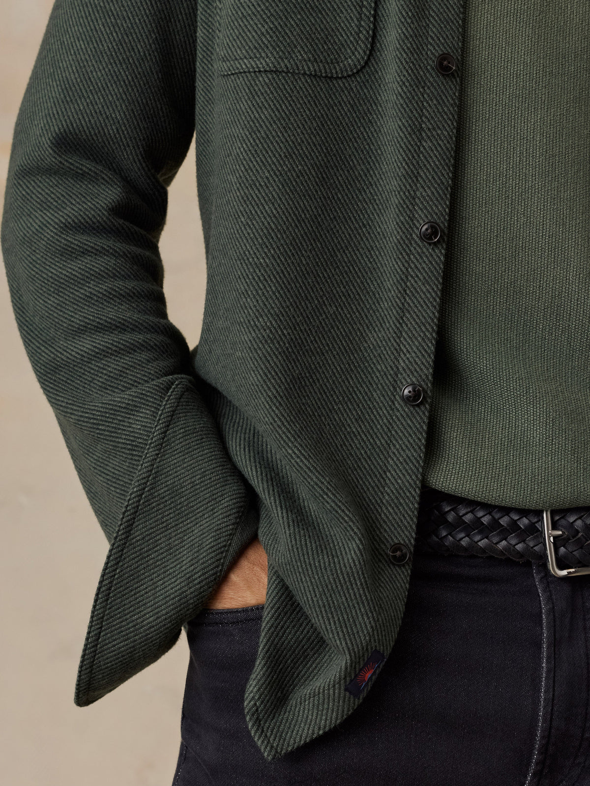 Close-up detail of Faherty Legend Sweater Shirt in dark evergreen twill with black buttons