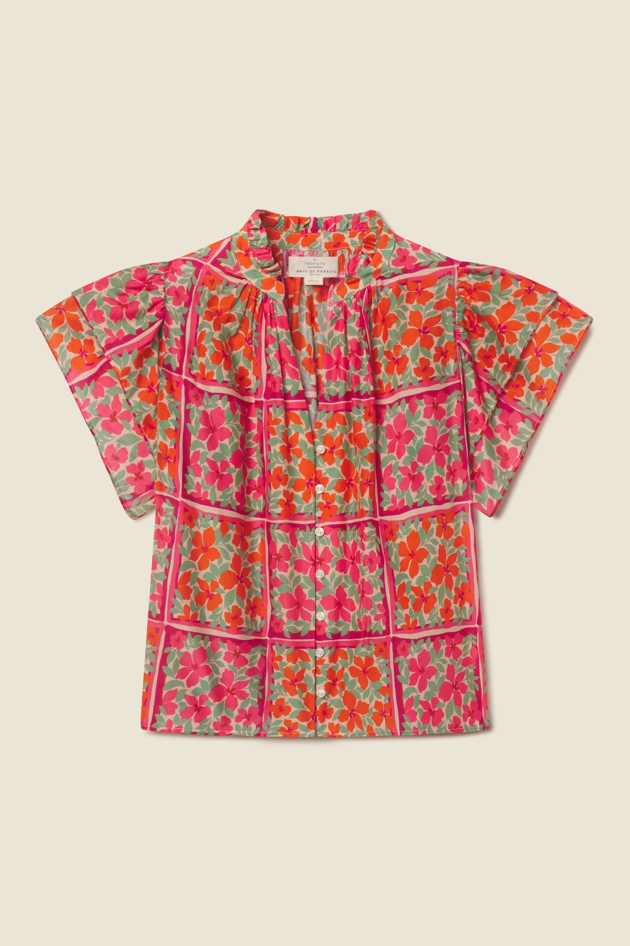 Colorful floral short sleeve blouse with vibrant pink and orange flowers on light background