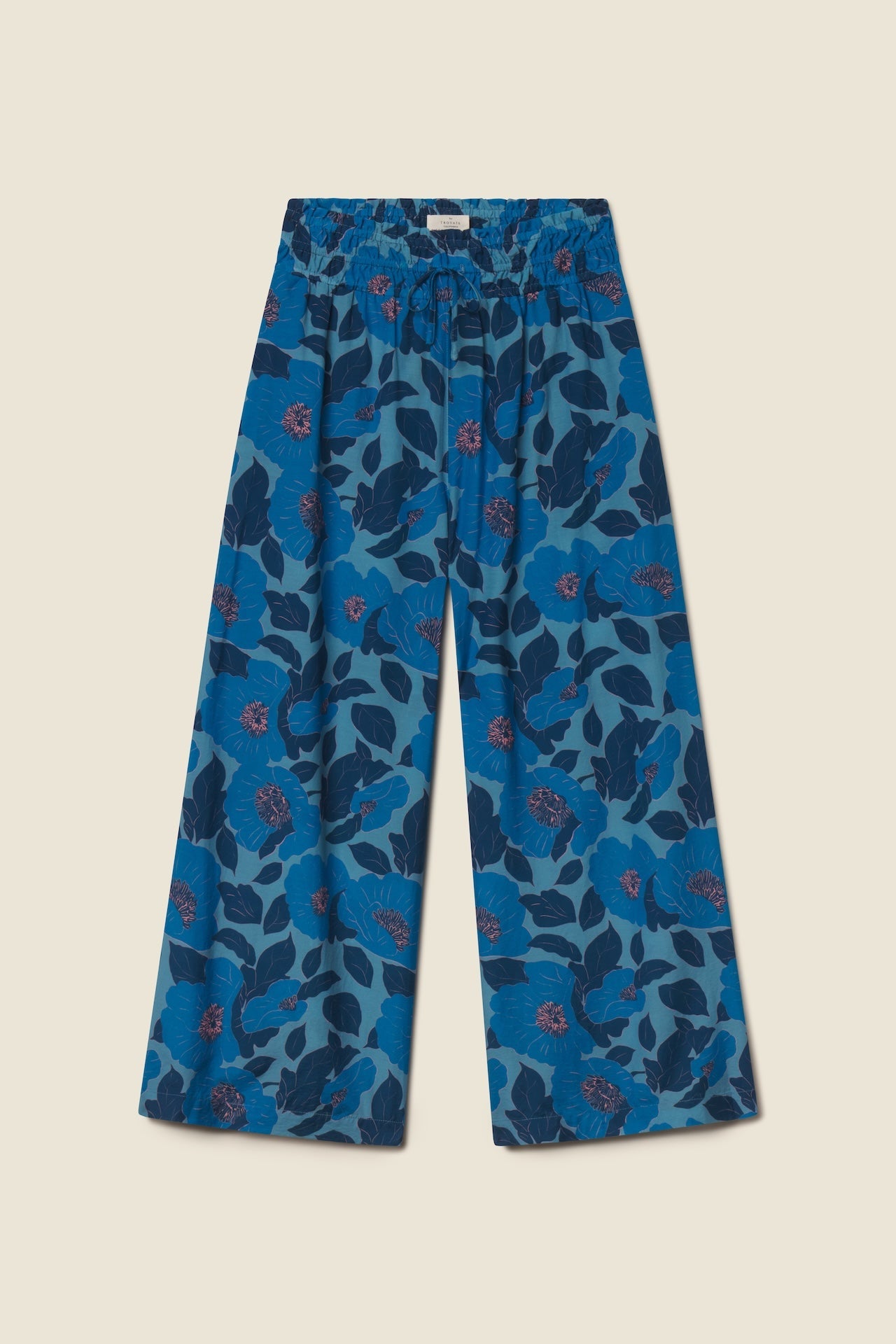 Blue wide-leg culotte pants with large floral print in various blue tones