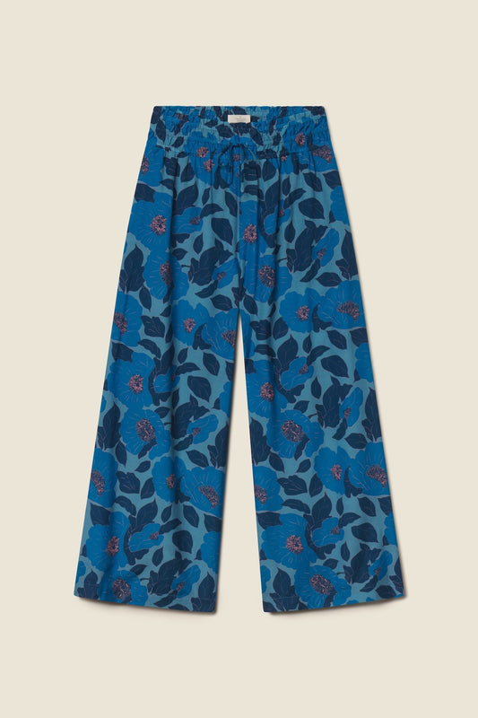 Blue wide-leg culotte pants with large floral print in various blue tones