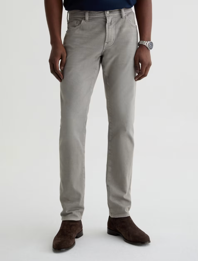 AG Tellis men's slim fit jeans in classic grey styled with dark suede boots and navy shirt