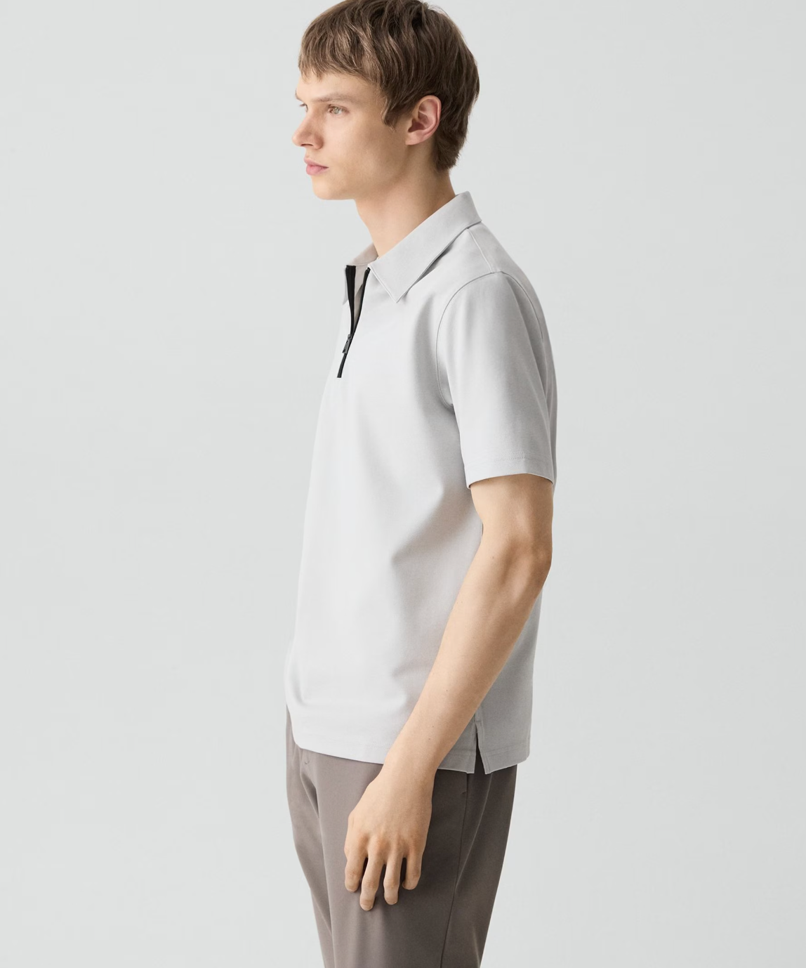 Theory Ryder Quartz men's zip polo shirt in light gray with black zipper detail and collar.