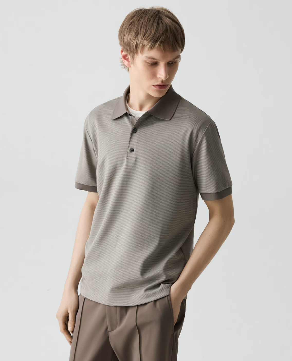 Theory Geo Polo in textured jacquard fabric featuring classic collar and button placket styling.