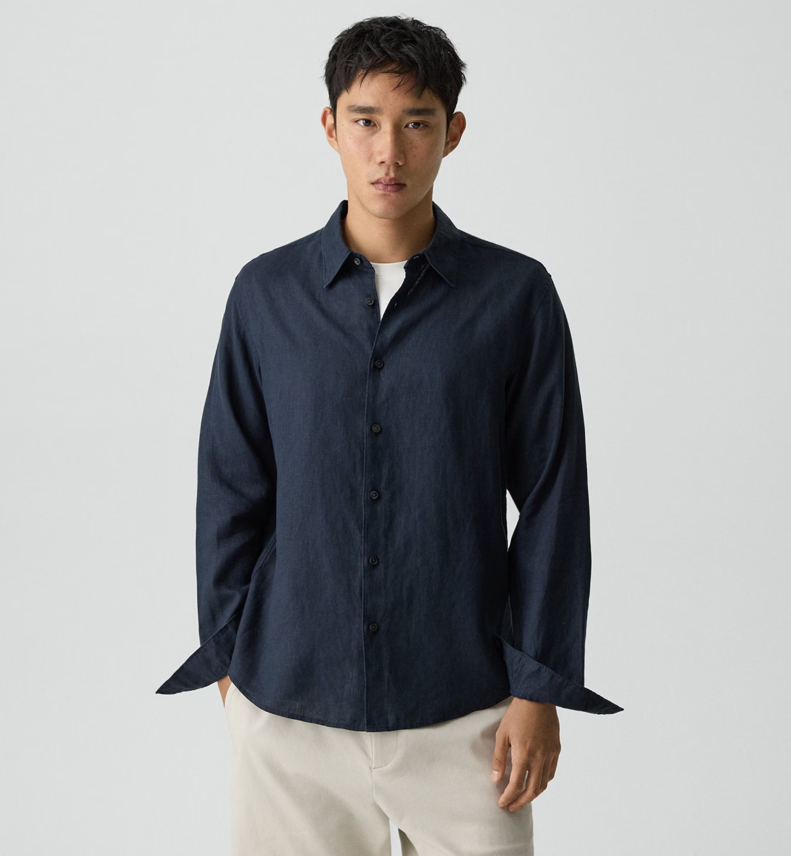 Theory Irving LS Relaxed Shirt in dark navy, featuring a classic collar and button-front closure on model.