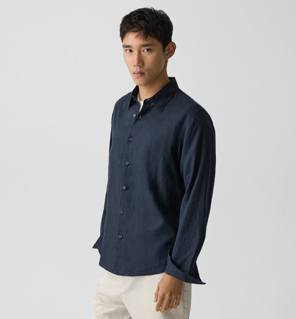 Theory Irving LS Relaxed Shirt in navy blue, featuring a classic collar and button-front closure on male model.