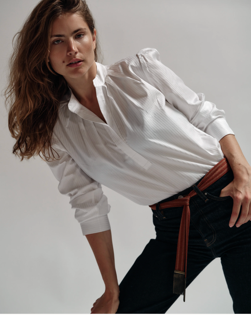 Cissa The Puff Shirt Duke Tonal Stripe white button-up blouse with puffy sleeves and striped texture, worn with dark jeans.