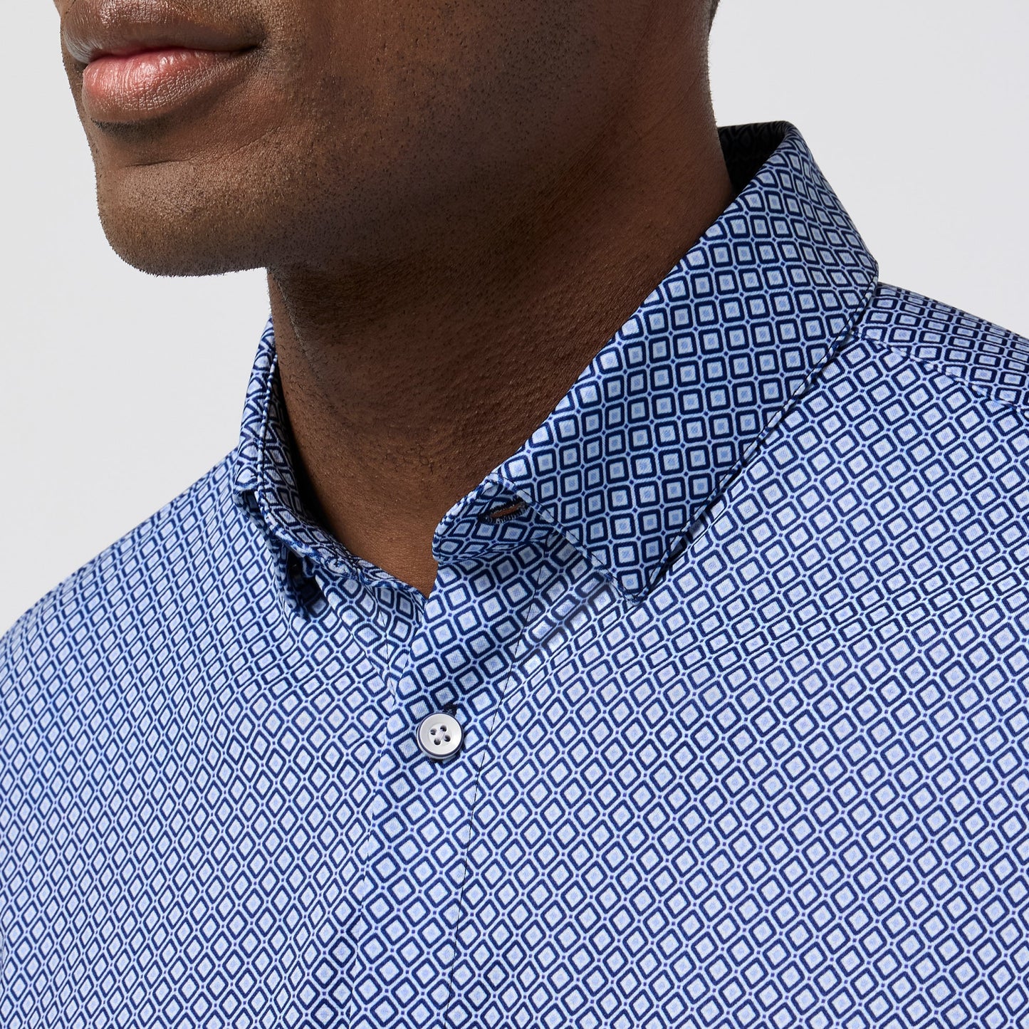 Close-up of Mizzen and Main Halyard short sleeve shirt featuring navy enlarged diamond geometric print pattern