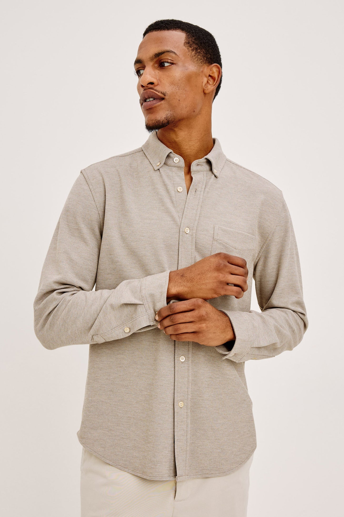 Man wearing Rails Vincent long sleeve button-down shirt in silt greige color