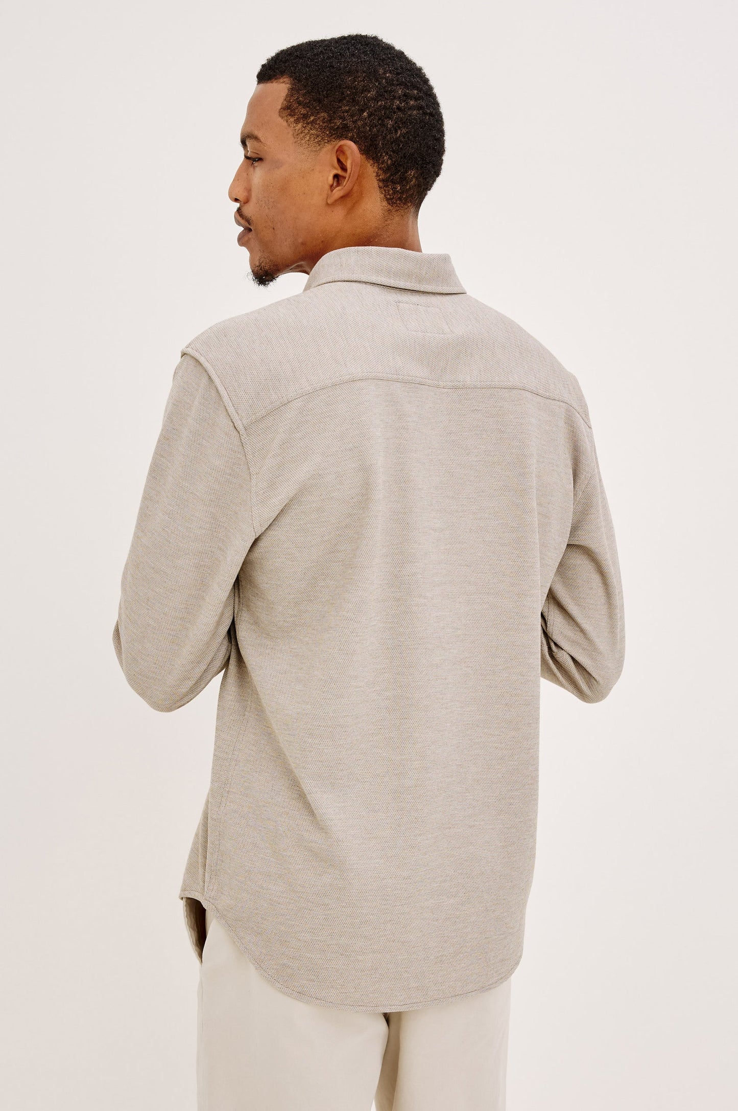 Male model wearing Rails Vincent long sleeve shirt in silt beige-gray, back view