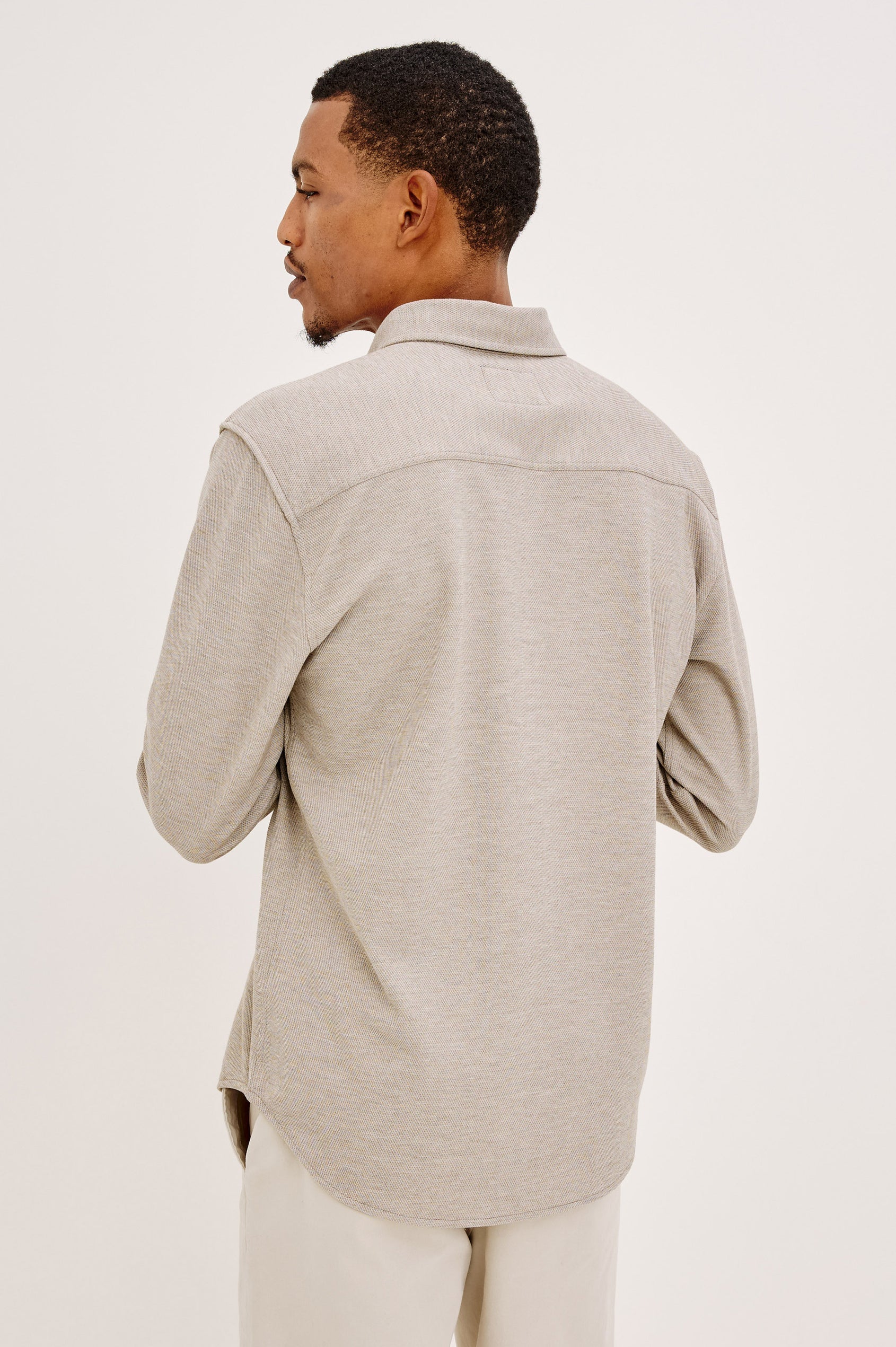 Male model wearing Rails Vincent long sleeve shirt in silt beige-gray, back view