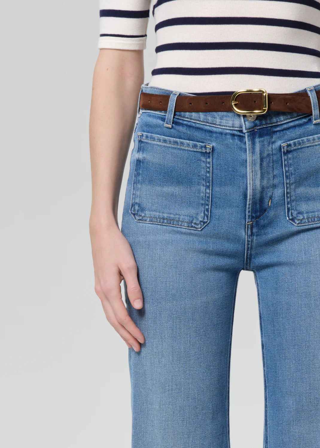 Citizens of Humanity Kimberly flare jeans with patch pockets, worn with striped top and brown belt