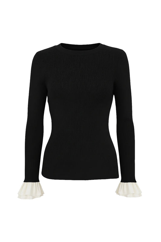 Black ribbed crew neck sweater with white ruffle cuffs by Le Superbe Extra
