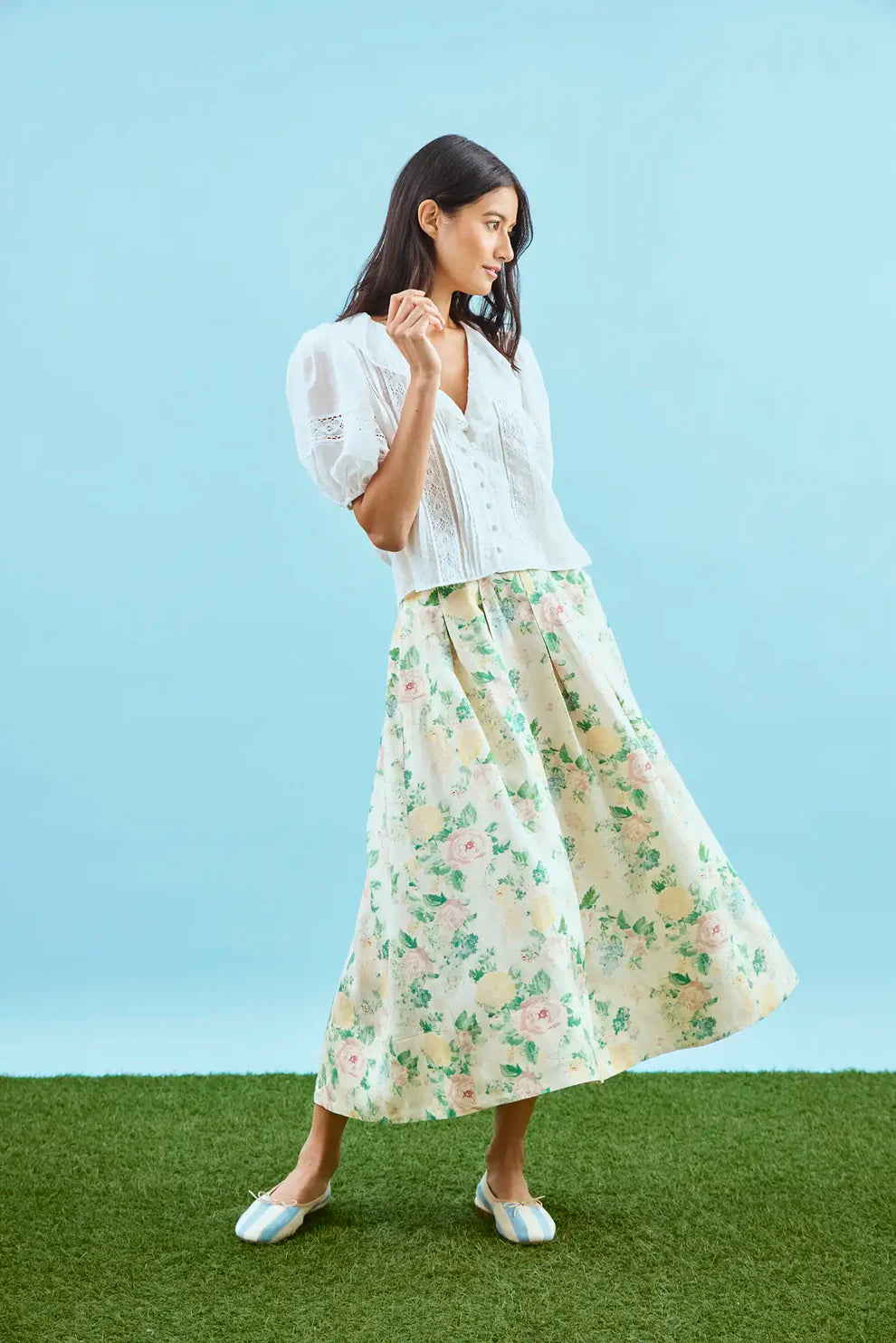 Hunter Bell Alexis midi skirt in garden rose peony floral print, styled with white blouse on model.