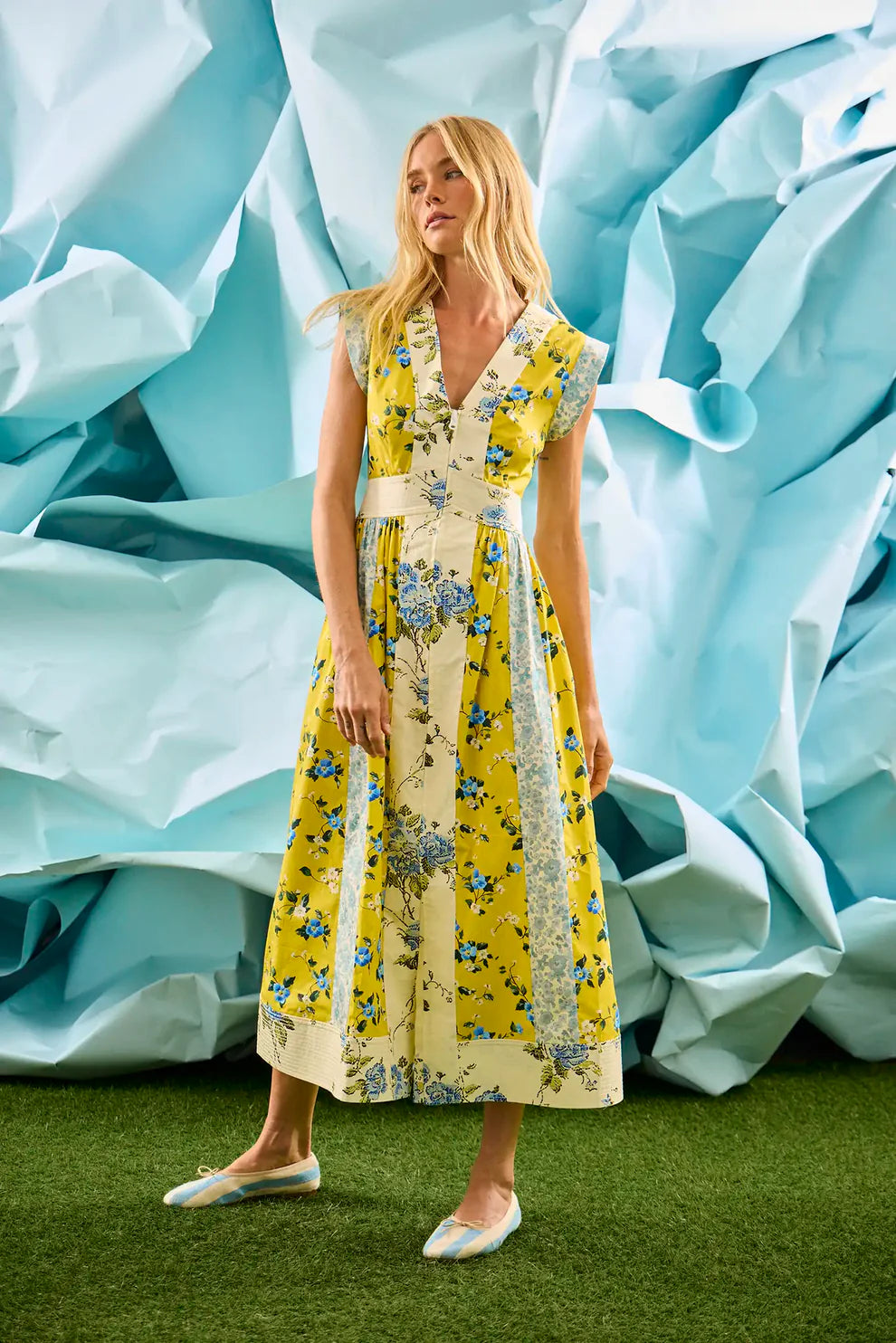 Hunter Bell April sleeveless midi dress with mixed floral print panels and v-neckline on model